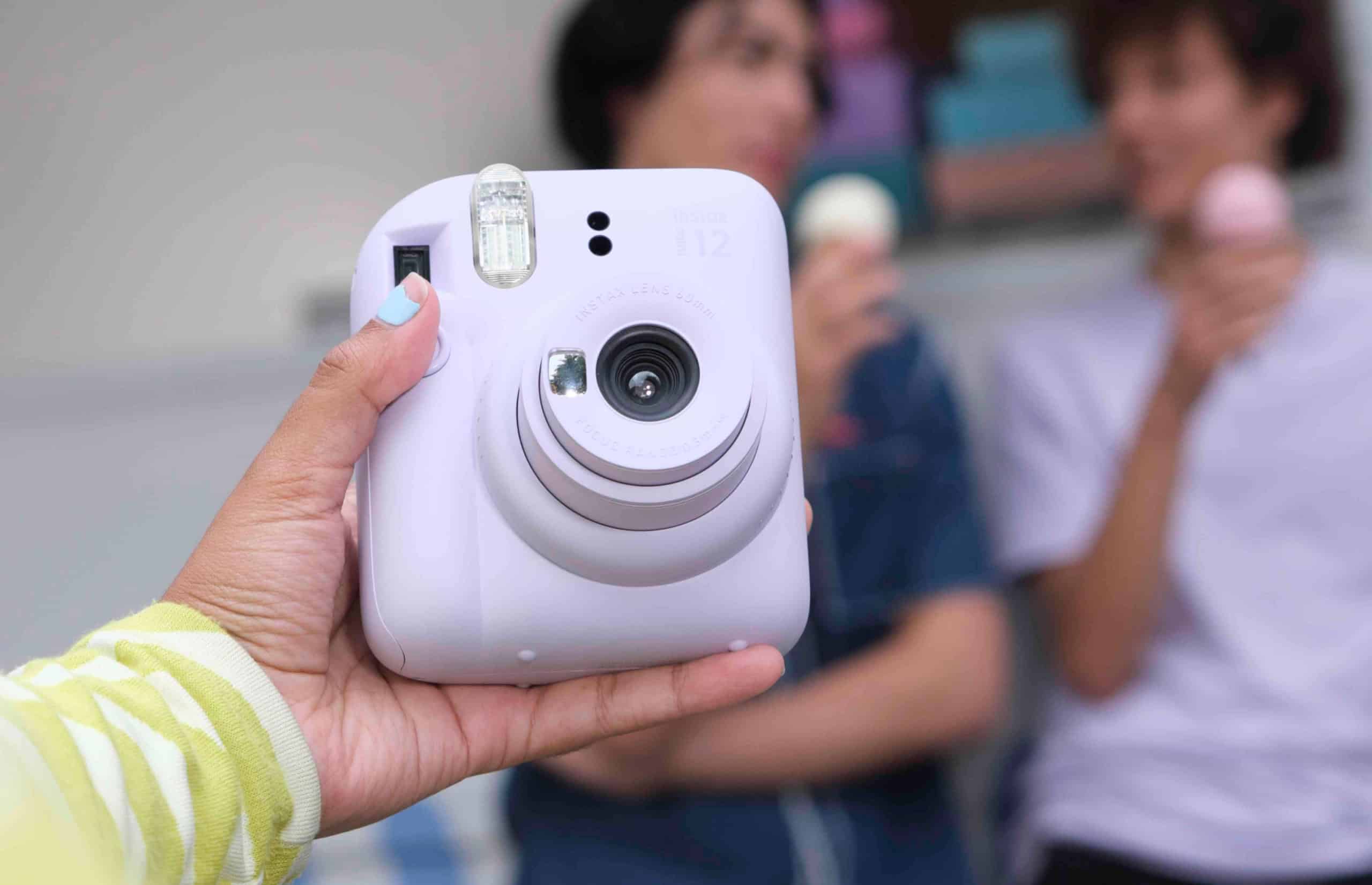 instax mini 12 instant camera being used