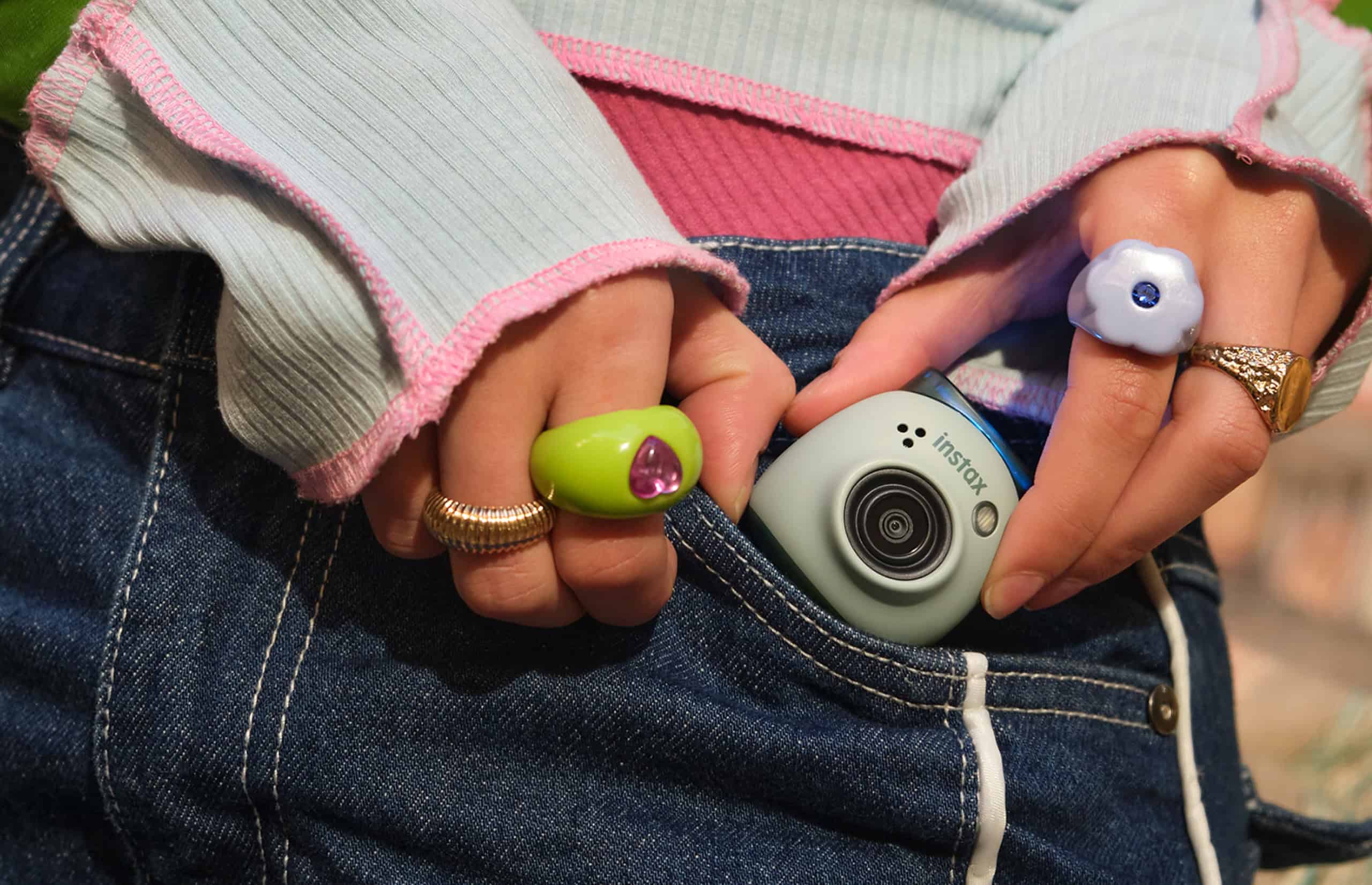 instax PAL camera being pulled of a users pocket
