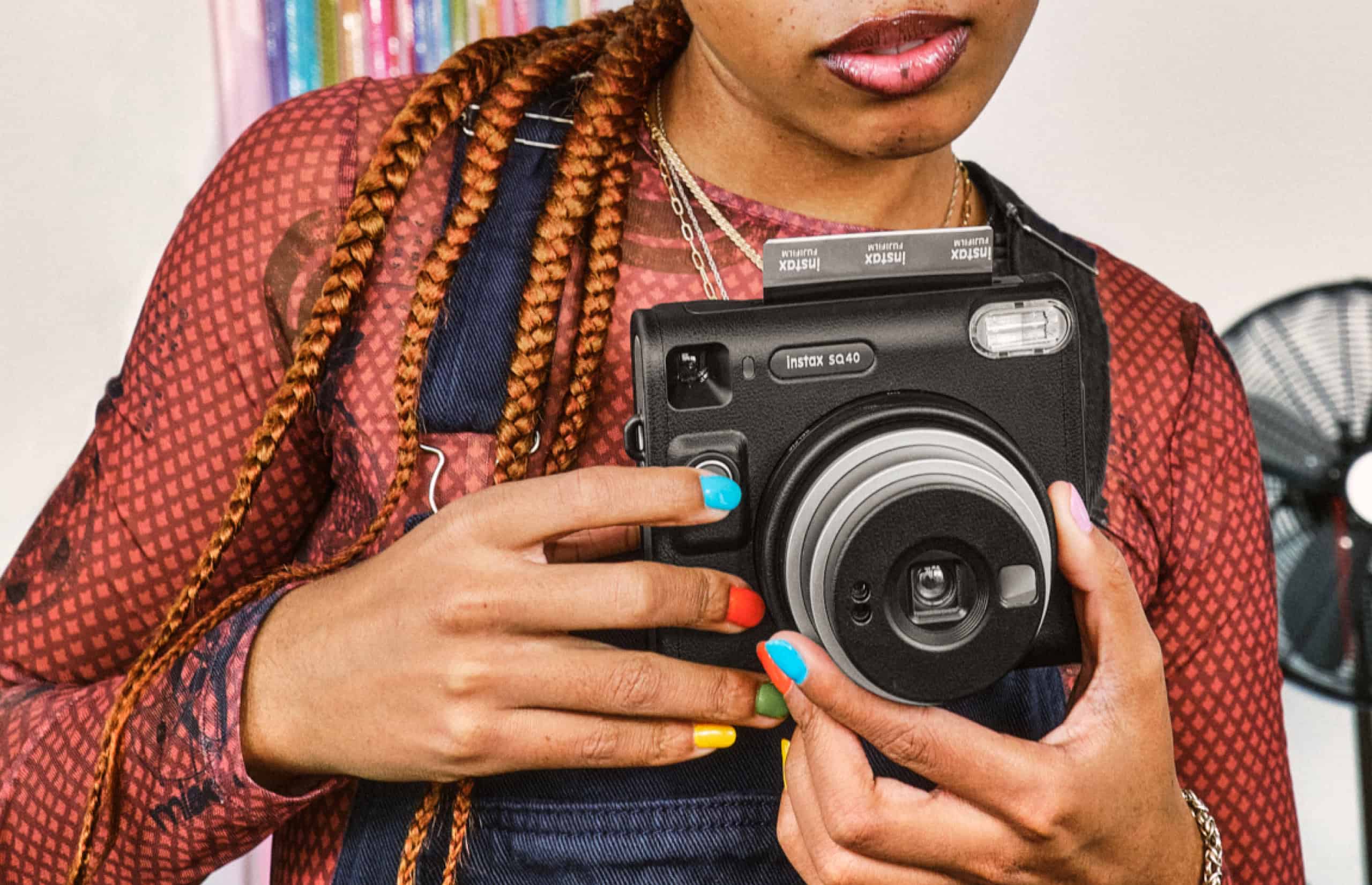 person using an instax SQ 40 camera