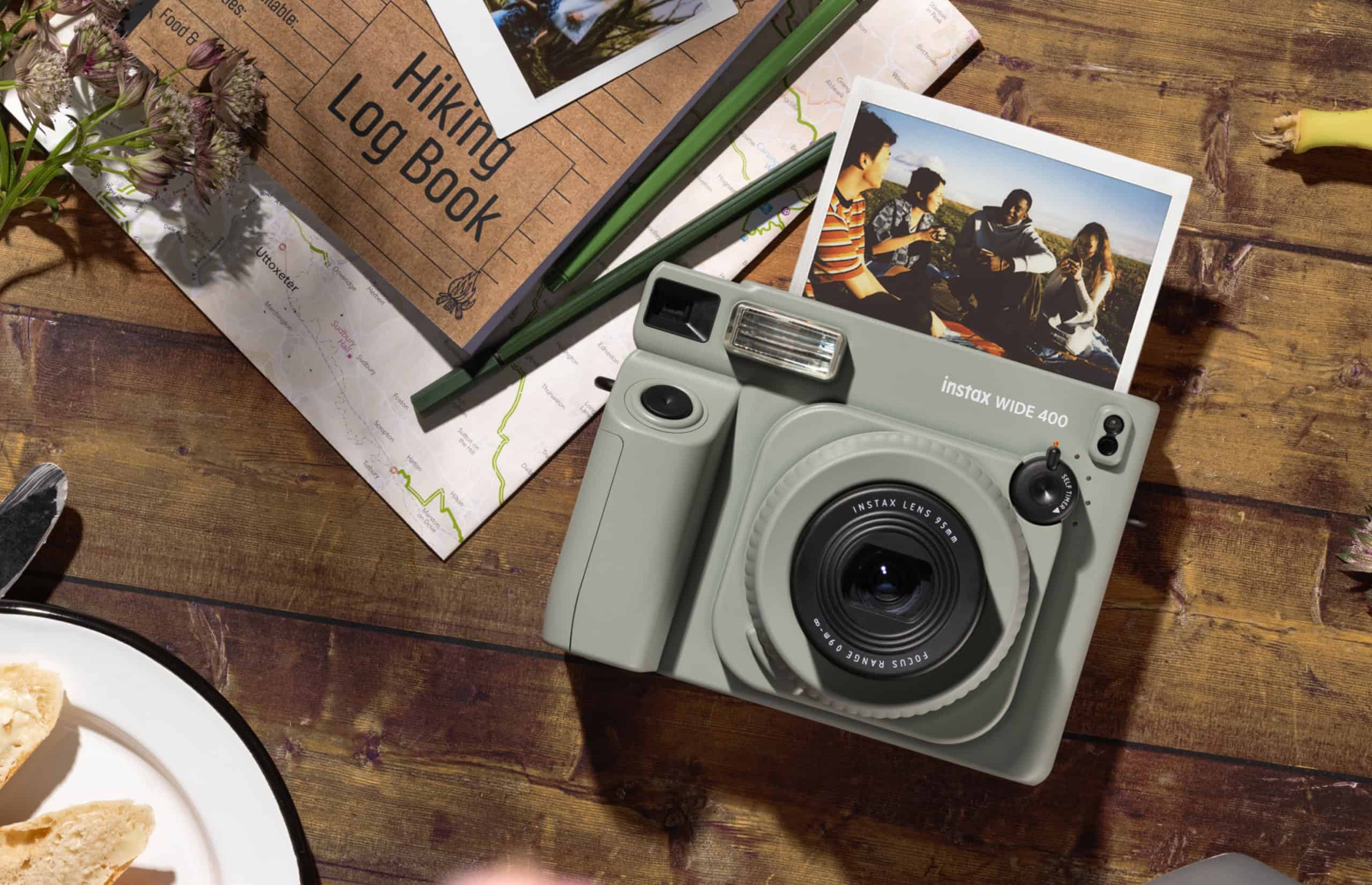 instax WIDE 400 instant camera on a table